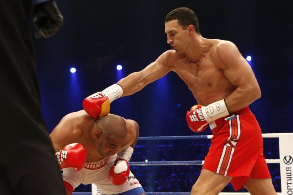IBF, WBA, WBO and IBO champion Wladimir Klitschko from Ukraine, right, punches his Australian challenger Alex Leapai during their heavyweight world title bout in Oberhausen, western Germany, Saturday, April 26, 2014. (AP Photo/Frank Augstein)